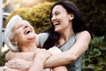 They share the same sense of humor. a happy senior woman spending quality time with her daughter outdoors. Royalty Free Stock Photo