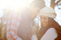 They share such a special bond. A loving young couple being affectionate while standing together in the outdoors.