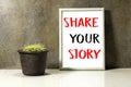 Share your story concept in ornate picture frame photo and Genus Echinocactus Cactus a potted plant on marble table