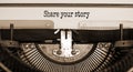 Share your story symbol. Words `share your story` typed on retro typewriter. Business and share your story concept. Copy space Royalty Free Stock Photo