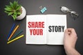 Share your story text on the notebook with businessman's hands Royalty Free Stock Photo