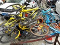 Shared bikes are stacked in a pile