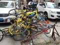 Shared bikes are stacked in a pile