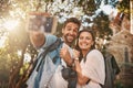 The shared experience of travel brings people together. a happy couple taking a selfie while out in a foreign country.