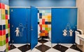 Shared family bright restroom in airport, mall. Unisex WC for mom, dad,little girl boy,child kid. Use together Royalty Free Stock Photo