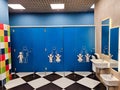 Shared family bright restroom in airport, mall. Unisex WC for mom, dad,little girl boy,child kid. Use together Royalty Free Stock Photo