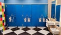 Shared family bright restroom in airport, mall. Unisex WC for mom, dad,little girl boy,child kid. Use together Royalty Free Stock Photo