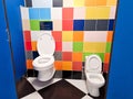 Shared family bright restroom with two toilet bowl in mall. Unisex WC for woman, man, mom dad, boy girl, kid. Use