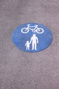 Shared foot and cycle path roundel sign painted on path Royalty Free Stock Photo
