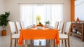 Shared Moments. White Chairs Encircle Long Table Draped in Vibrant Orange Royalty Free Stock Photo