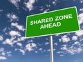 shared zone ahead traffic sign on blue sky Royalty Free Stock Photo