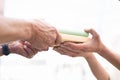 Sharing Books. Hand Closeup Giving Book