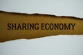 Sharing Economy text on paper craft with white paper torn ripped of horizontal Royalty Free Stock Photo