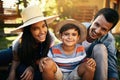 Sharing the joy of gardening together. Portrait of a happy family gardening together in their backyard. Royalty Free Stock Photo