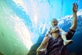 Sharing new experiences together. a father and his little daughter looking at an exhibit in an aquarium. Royalty Free Stock Photo