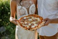 sharing a pizza, in casual prewedding clothes