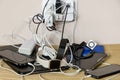 Sharing power: power adapter and power banks charging multiple devices in a messy cable connection Royalty Free Stock Photo
