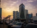 Sharjah city towers, bridge, street at sunset