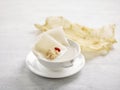 Shark Cartilage Soup with Fish Maw and Conpoy Served in a bowl isolated on wooden board side view on grey background