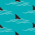 Shark fins on a blue background.