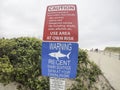 Shark warning signs at entrance to beach