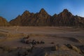 Sharm El Sheikh, Egypt - 22 Dec 2019: Buggy race trip at sand desert near mountains. Buggies halt. Leisure in Africa Royalty Free Stock Photo