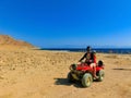 Sharm El Sheikh, Egypt - February 17, 2020: The people at quad tour in the desert in Egypt