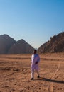 SHARM EL SHEIKH, EGYPT - JULY 9, 2009. Bedouin walking on desert