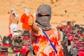 SHARM EL SHEIKH, EGYPT - JULY 9, 2009. Caucasian girl in head kerchief in the desert