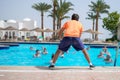 Sharm El Sheikh, Egypt - March 07, 2020: The trainer does an aqua gym class in the pool of an expensive hotel. The animator