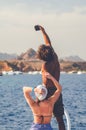 Sharm El Sheikh, Egypt May 08, 2019: Dark curly guy with a white girl take a selfie on a smartphone on the background of the sea a