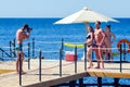 Sharm El Sheikh, Egypt May 12, 2019: Photographer taking pictures of young people on the pier