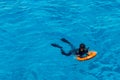 Sharm El Sheikh, Egypt, May 8, 2019: young man with a lifebuoy swims in sea blue water