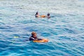 Sharm El Sheikh, Egypt, May 8, 2019: young man with a lifebuoy swims in sea blue water