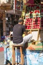 A typical shopping street with Arabic shops, the seller arranges the fruit on the street market, Sharm el Sheikh, Egypt Royalty Free Stock Photo