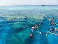 Sharm El Sheikh, Egypt - September 10, 2020: A group of tourists swims in the Red Sea near pleasure boats at Sharm El Sheikh,