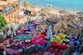 People are relaxing in popular Farsha cafe outdoors on shore of Red Sea in Hadaba district, Sharm El Sheikh, Egypt