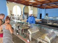 Sharm El Sheikh, Egypt - September 14, 2020: Waiter serving food at restaurant at Hotel Siva Sharm at Sharm El Sheikh