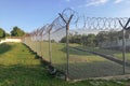 Sharp barbed wire on security fence protecti secure private space Royalty Free Stock Photo