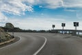 A sharp bend on an empty tarmac road