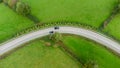 Sharp bend in a road with Chevron warning signs. Aerial view from above.