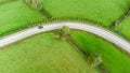 Sharp bend in a road with Chevron warning signs. Aerial view from above.