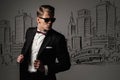 Sharp dressed man in black suit against city Royalty Free Stock Photo