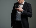 Sharp dressed man wearing jacket with glass of vine Royalty Free Stock Photo
