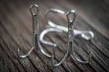 Sharp fish hooks photographed close-up. Sharpened hook will not give a chance to fish to escape from the fisherman. Royalty Free Stock Photo