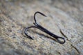 Sharp fish hooks photographed close-up. Sharpened hook will not give a chance to fish to escape from the fisherman. Royalty Free Stock Photo