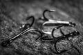 Sharp fish hooks photographed close-up. Sharpened hook will not give a chance to fish to escape from the fisherman. Royalty Free Stock Photo