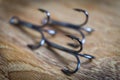 Sharp fish hooks photographed close-up. Sharpened hook will not give a chance to fish to escape from the fisherman. Royalty Free Stock Photo