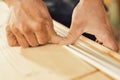 Sharp focus on skilled, determined woodworker\'s work