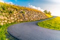 Sharp hairpin curve of narrow rural asphalt road in the mountains. Austrian Alps, Austria Royalty Free Stock Photo